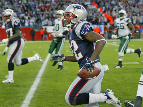 Patriots cornerback Asante Samuel (22) had the ball, and he left the Jets in the dust as he headed for the end zone on this fourth-quarter interception return for a touchdown.
