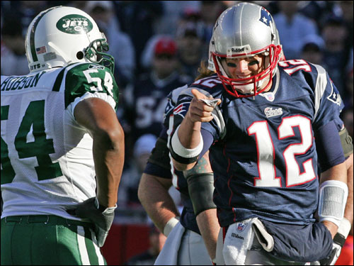 Tom Brady pointed toward Jets linebacker Victor Hobson and their bench after they were penalized for having too many men on the field.