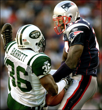Patriots receiver Chad Jackson (right) battled with Jets corner David Barret, but neither came down with the deep pass.
