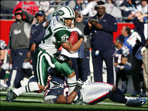 Patriots Ellis Hobbs tripped up Jets Laveranues Coles after a 8-yard reception during first quarter .