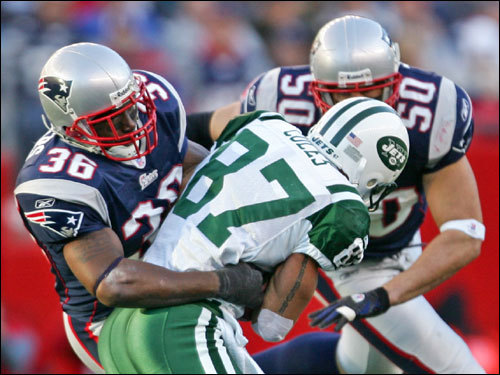 James Sanders (36) held up the Jets Laveranues Coles after a 13-yard reception as teammate Mike Vrabel prepared to make the hit.