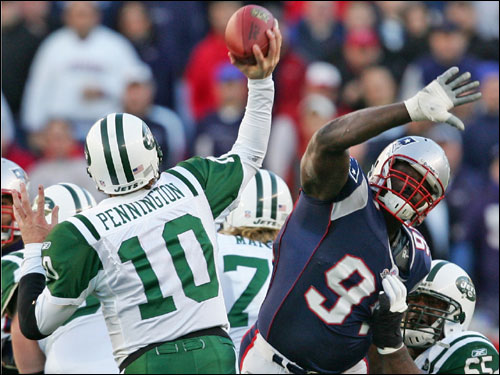 Patriots Jarvis Green put pressure on New York Jets quarterback Chad Pennington during third quarter action.