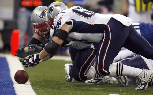 Patriots Dan Koppen (front) and Logan Mankins (70) dove for a fumble that ended up in a touchdown recovered by Mankins.