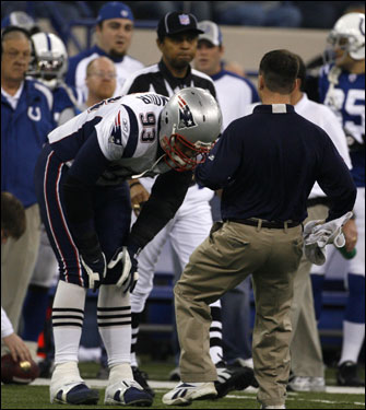 Richard Seymour (left) stood on the sideline after injuring his leg on the first defensive play of the game.