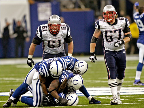 The Colts pile on Marlon Jackson after he intercepted Tom Brady's pass late in the fourth quarter.