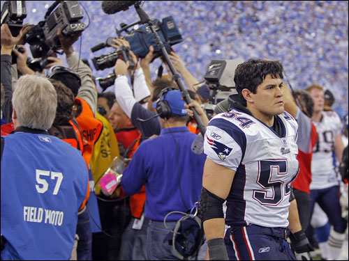 Tedy Bruschi appeared stunned as he leaves the field after the Patriots' 38-34 loss to the Colts.