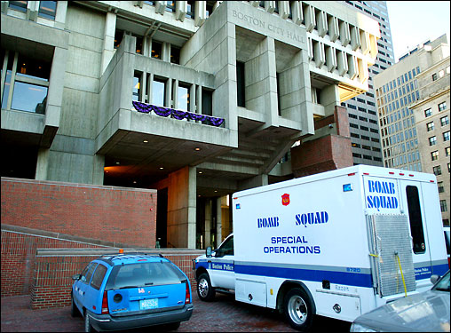 Boston police analyst recognizes the various images as a cartoon character. Bomb-sniffing dogs arrive at City Hall and begin going through hallways and city councilors' offices.