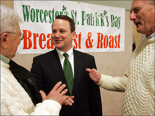 March 11 : With Patrick's curtailed schedule, Lieutenant Governor Timothy P. Murray will assume more duties in the coming weeks. Murray (center) talks with Dudley Bowker (left) and Birch Frank (right) at the Worcester St. Patrick's Day Breakfast and Roast, held at the Elks Lodge on Mill St. in Worcester.