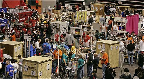Fifty high schools and over a thousand students took over the Harry Agganis Arena at Boston University on Thursday, Day 1 of Boston FIRST, a regional robotics competition. At 9 a.m. Thursday, the pit area was bustling with teams.