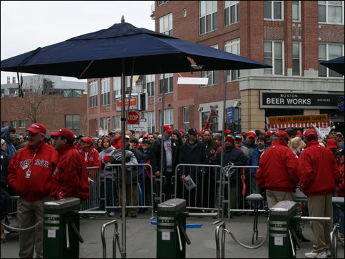 Fans wait for the gates to open along Yawkey Way.