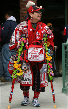 Despite being on crutches, loyal Sox fan, Lynne Smith from Wellesley, makes her way around the grandstand.