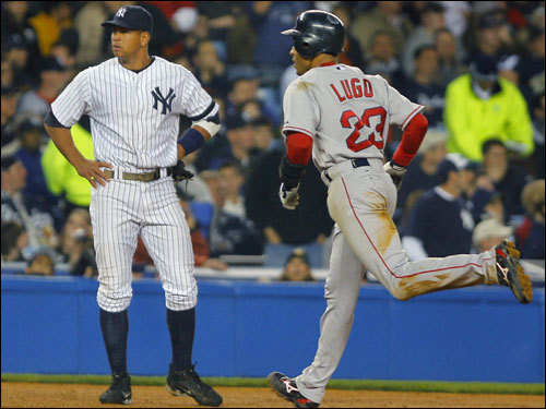 Yankees third baseman Alex Rodriguez (left) looked away as Red Sox shortstop Julio Lugo rounded the bases following his solo home run.