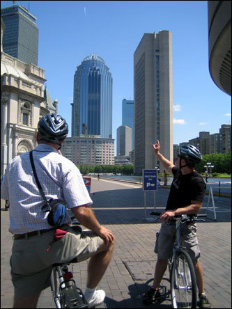 After leaving the MFA, the tour proceeds to the entrance at the Christian Science Center, where Prescott (right) explains some of the architectural history of the surrounding Back Bay area.
