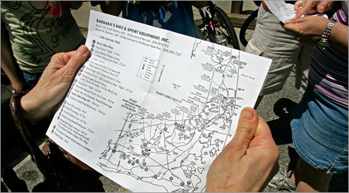 Maps provided by a local bicycle rental company guide trail enthusiasts.