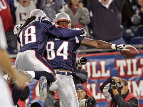 Pats wide receiver Donte Stallworth (18) celebrated with Ben Watson (84) after Watson's first-quarter touchdown.