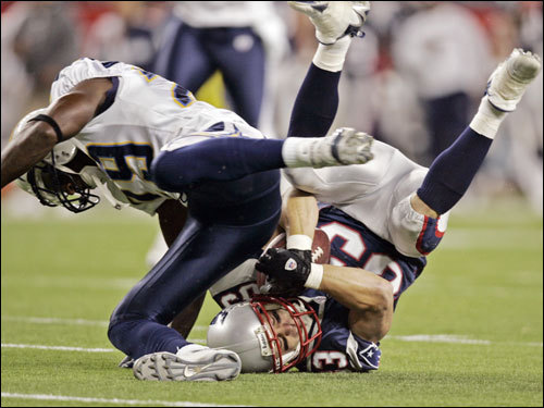 Patriots receiver Wes Welker was tackled after a reception in the first quarter.