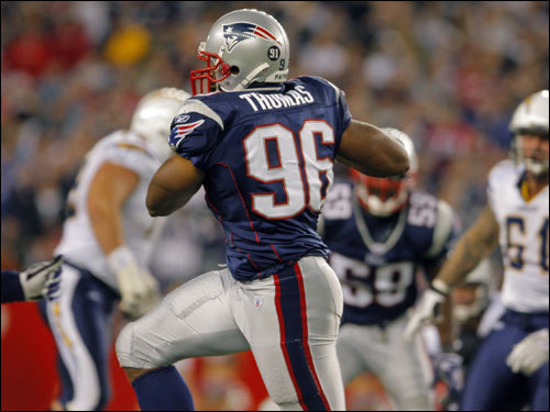 Patriots linebacker Adalius Thomas picked off a pass and headed toward the end zone in the second quarter.