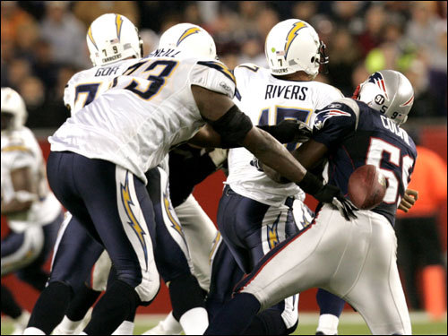 Patriots linebacker Rosevelt Colvin stripped Chargers QB Phillip Rivers in the third quarter.