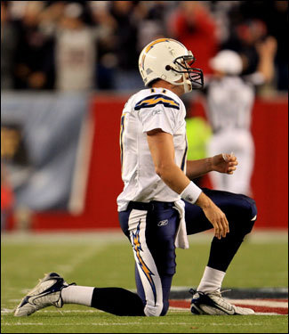 Chargers QB Phillip Rivers kneeled on the turf after throwing an interception that was returned for a touchdown.