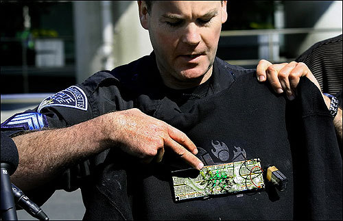 State Police Sgt. David Thompson displayed the circuit board on Simpson's sweatshirt.