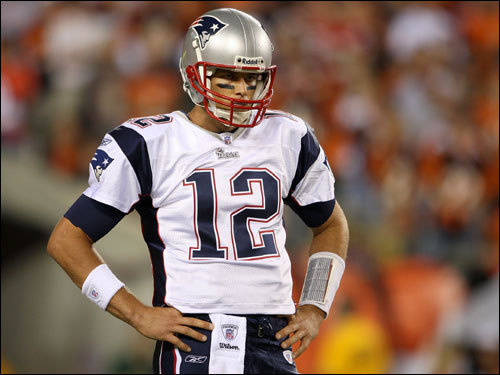 Tom Brady paused during action in the first half.