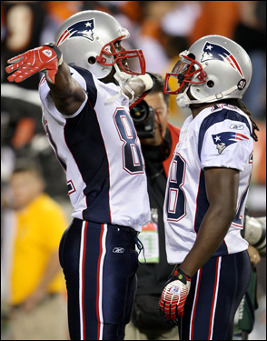 Randy Moss (left) celebrated with Donte Stallworth after scoring a fourth-quarter touchdown.