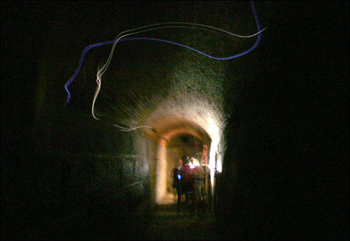 After the execution, many reported a 'lady in black' stalking the island. She is said to have scared a sentry away from his post. In the Bastion A staircase, some say they've heard her voice. The light seen in this picture baffles our photographer: 'I can't explain what the streaks of lights are in the pitch black coal room tunnel where a group of kids from Lexington Christian Academy were passing through. One of them had a flashlight, but nobody passed through the tunnel during the two-second exposure.'