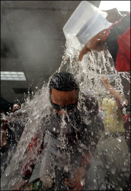 Lugo was drenched by a bucket of water during the celebration.