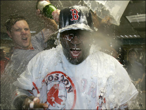 Ortiz (right) was doused with champagne by Papelbon (left) during the celebration.