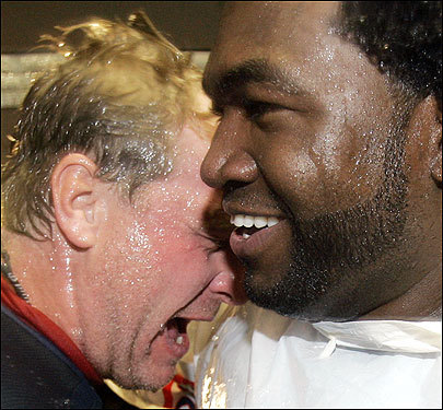 Red Sox pitcher Curt Schilling (left) and designated hitter David Ortiz celebrated their American League Division Series win over the Los Angeles Angels on Sunday. Schilling picked up the win with seven shutout innings. Ortiz did his part with a home run.