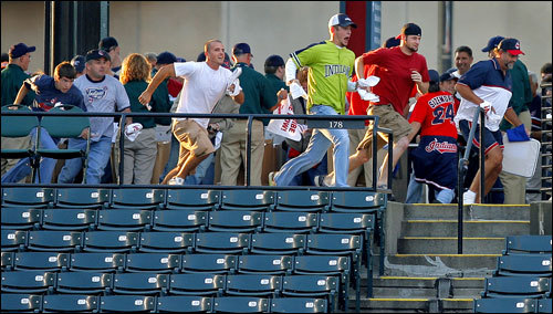 When the gate behind the left field bleachers opened up, the first fans in line sprinted to try and get the coveted front row spots from which to catch balls hit over the wall during batting practice.