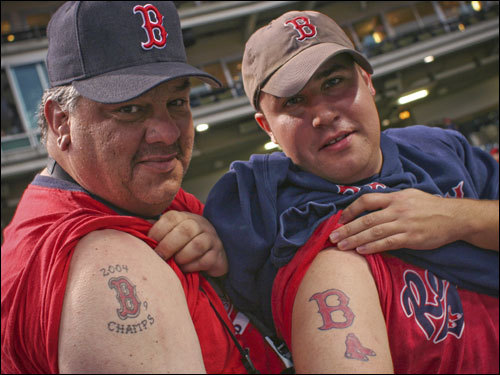 Ted Spencer (left) of Kentucky and Matt Sumpter (right) of Indianapolis show off their Red Sox tattoos.