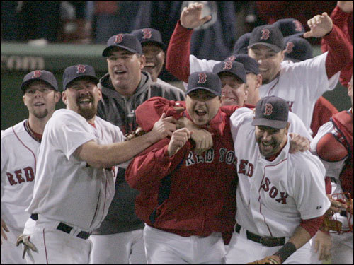 Red Sox players hugged on the field during celebrations.