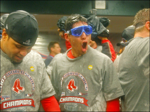 Jacoby Ellsbury (center) celebrates in the Red Sox' clubhouse.