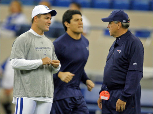Colts kicker Adam Vinatieri (left) talked to Patriots defensive coordinator Dean Pees (right) while his former teammate Tedy Bruschi jogged by in the background before game time on the field at the RCA Dome.