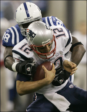 Pats QB Tom Brady (12) was sacked by Robert Mathis on the first New England offensive play in the first quarter.