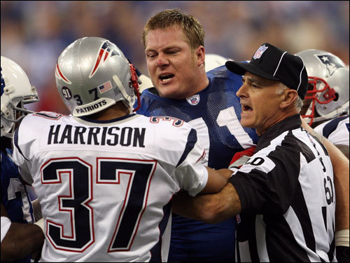 Line judge Gary Cavaletto (60) attempted to separate Colts lineman Ryan Diem (71) and Rodney Harrison (37) during first quarter action.