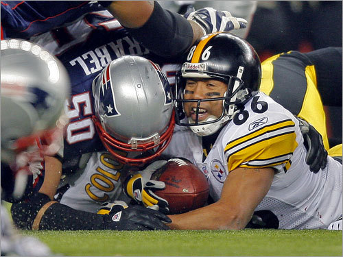 The Patriots defense stopped Steelers wide receiver Hines Ward (86) short of the goal line on this fourth-down attempt.