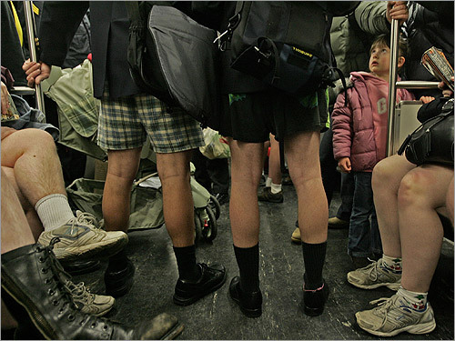 Five-year old Emily Nye looked up in bewilderment as she and her parents, who are tourists from England, were surrounded by people wearing no pants while riding the inbound Red Line.