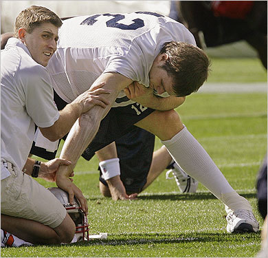 Tom Brady had ointment rubbed into his throwing arm before practice began.