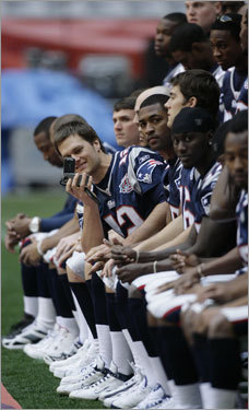 Brady used a camera of his own during the team's picture.