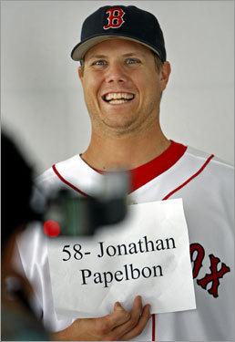 Sunday was the annual 'Photo Day' in camp. Starting at 7 a.m. and running until about 9:15 a.m., Red Sox players went through over a dozen stations set up in the clubhouse, the team dining room, as well as outside, where they had their photographs taken for various uses. Here closer Jonathan Papelbon has some fun with a photographer, as he makes a bizarre face before settling down and posing normally.