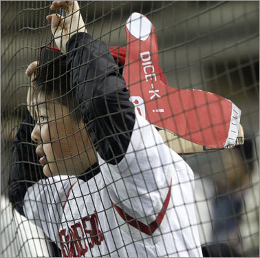 A young Red Sox fan watched the players on the field prior to the start of the second exhibition game the Red Sox played in Japan, this one against the Yomiuri Giants on Sunday.
