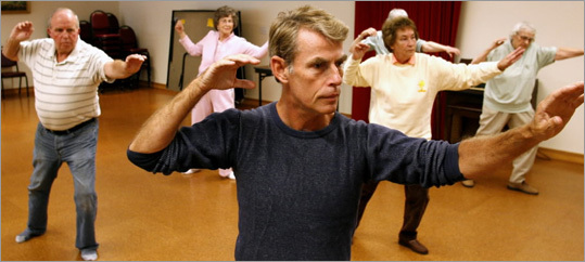 Tai chi Elliot Edwards, center, instructs a class at the Medway Senior Center in Norfolk.