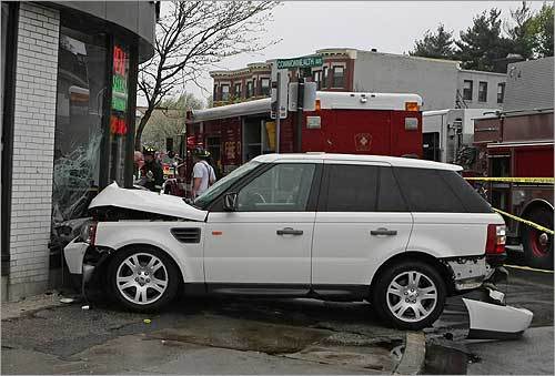 This Range Rover was pushed into Comm. Ave. Associates, a realty office that was unoccupied at the time, at the corner of Commonwealth and Brighton avenues. Michael Jardus, the company owner and president, joked that his daughter wanted a Range Rover. 'I called her and said ‘I got one delivered, but it's a little dented.' '