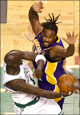 Kevin Garnett looked to keep the ball from Laker reserve Ronny Turiaf.