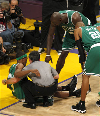 Rajon Rondo (left) had to be helped off of the court after suffering a mild ankle sprain in the third quarter.