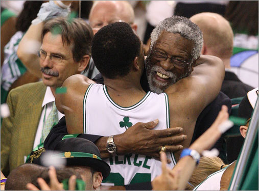Paul Pierce (34) and Bill Russell (right) embraced on the court after the Celtics victory.
