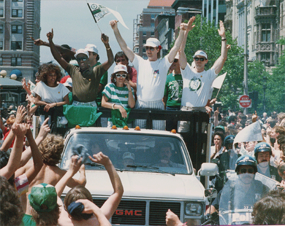 In the Boston Celtics celebration of 1986, fans gathered along the streets as the team rode through the city in a truck.