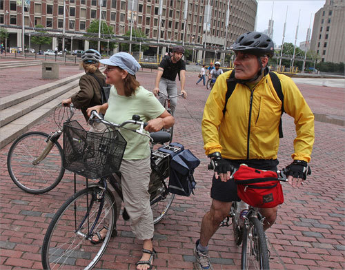 After the severe weather and storms in the Boston area yesterday, the skies cleared up for the biking event and temperatures are expected to increase later in the day. Rebecca Albrecht (left) of Brookline and John Quatrele arrived at the plaza this morning.